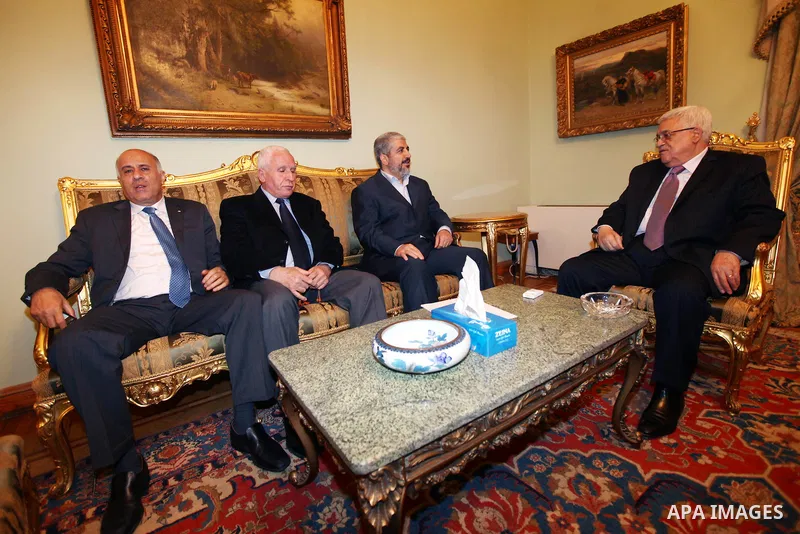 Palestinian President, Mahmoud Abbas (Abu Mazen), meets the exiled leader of the Palestinian Islamist movement Hamas, Khaled Meshaal, and Palestinian Fatah members Azzam al-Ahmed, and Jibril Rajoub, meet in Cairo on Dece...