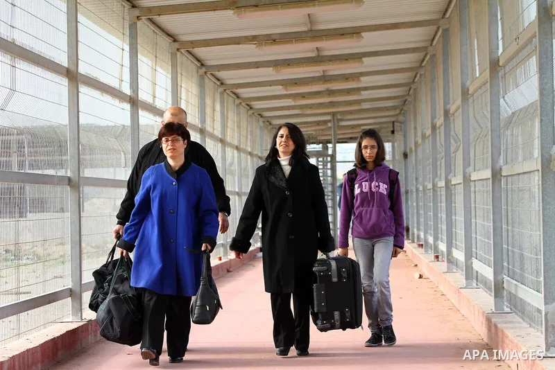 A Christian Palestinian family leaves Gaza to enter Israel through the Erez border crossing between Israel and northern Gaza Strip on Dec. 22,2011. The Israeli army on Thursday allowed some 550 Christian Palestinians to...