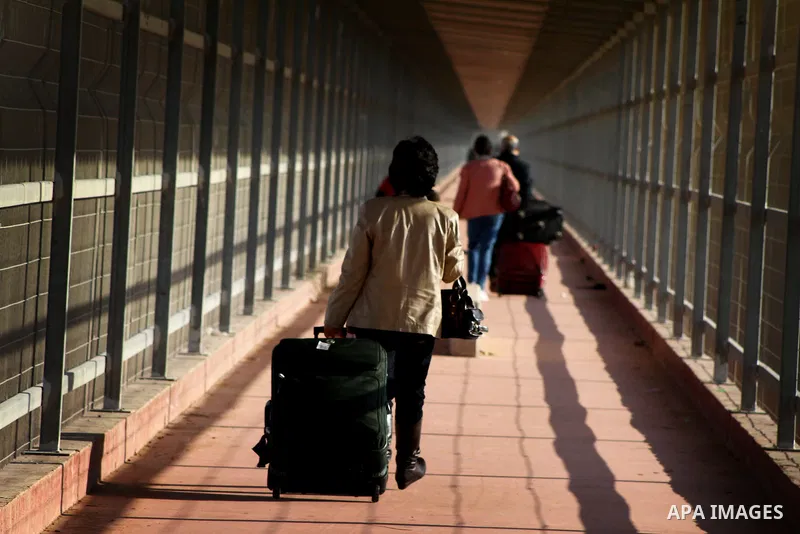 A Christian Palestinian family leaves Gaza to enter Israel through the Erez border crossing between Israel and northern Gaza Strip on Dec. 22,2011. The Israeli army on Thursday allowed some 550 Christian Palestinians to...