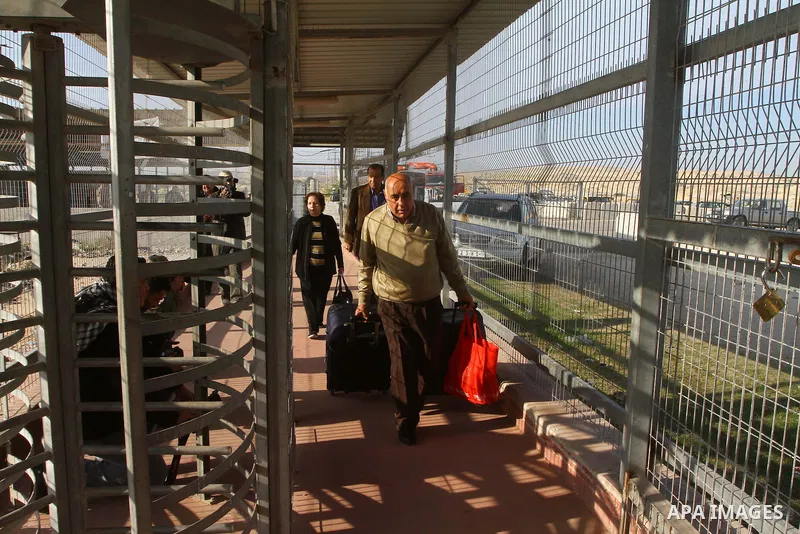 A Christian Palestinian family leaves Gaza to enter Israel through the Erez border crossing between Israel and northern Gaza Strip on Dec. 22,2011. The Israeli army on Thursday allowed some 550 Christian Palestinians to...