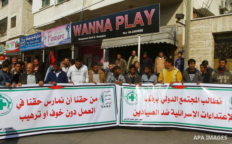 Palestinian fishermen take part in a protest in front of the Red Cross a protest against the Israel army assaults on fishermen in Gaza City, on Dec. 22. 2011. Photo by Ashraf Amra
