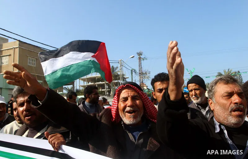 Palestinian fishermen take part in a protest in front of the Red Cross a protest against the Israel army assaults on fishermen in Gaza City, on Dec. 22. 2011. Photo by Ashraf Amra