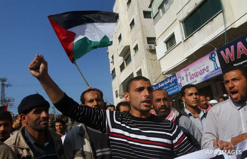 Palestinian fishermen take part in a protest in front of the Red Cross a protest against the Israel army assaults on fishermen in Gaza City, on Dec. 22. 2011. Photo by Ashraf Amra