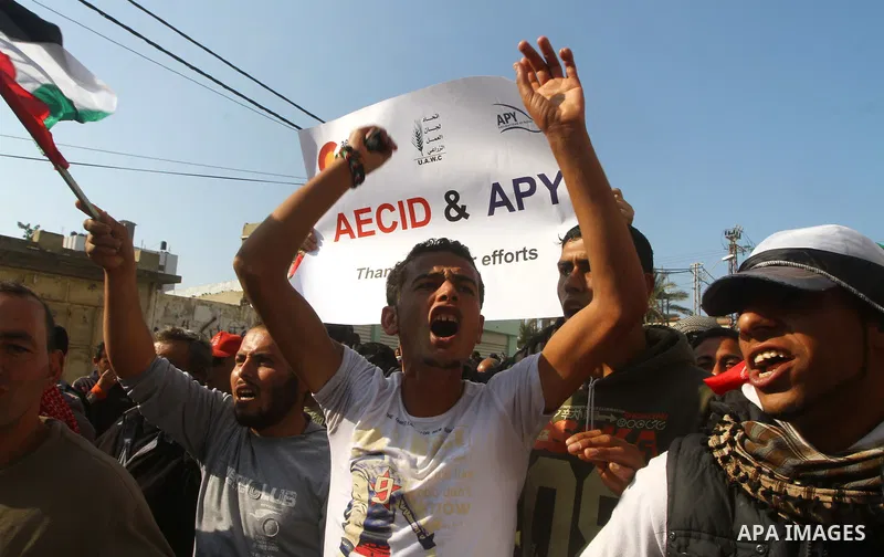 Palestinian fishermen take part in a protest in front of the Red Cross a protest against the Israel army assaults on fishermen in Gaza City, on Dec. 22. 2011. Photo by Ashraf Amra