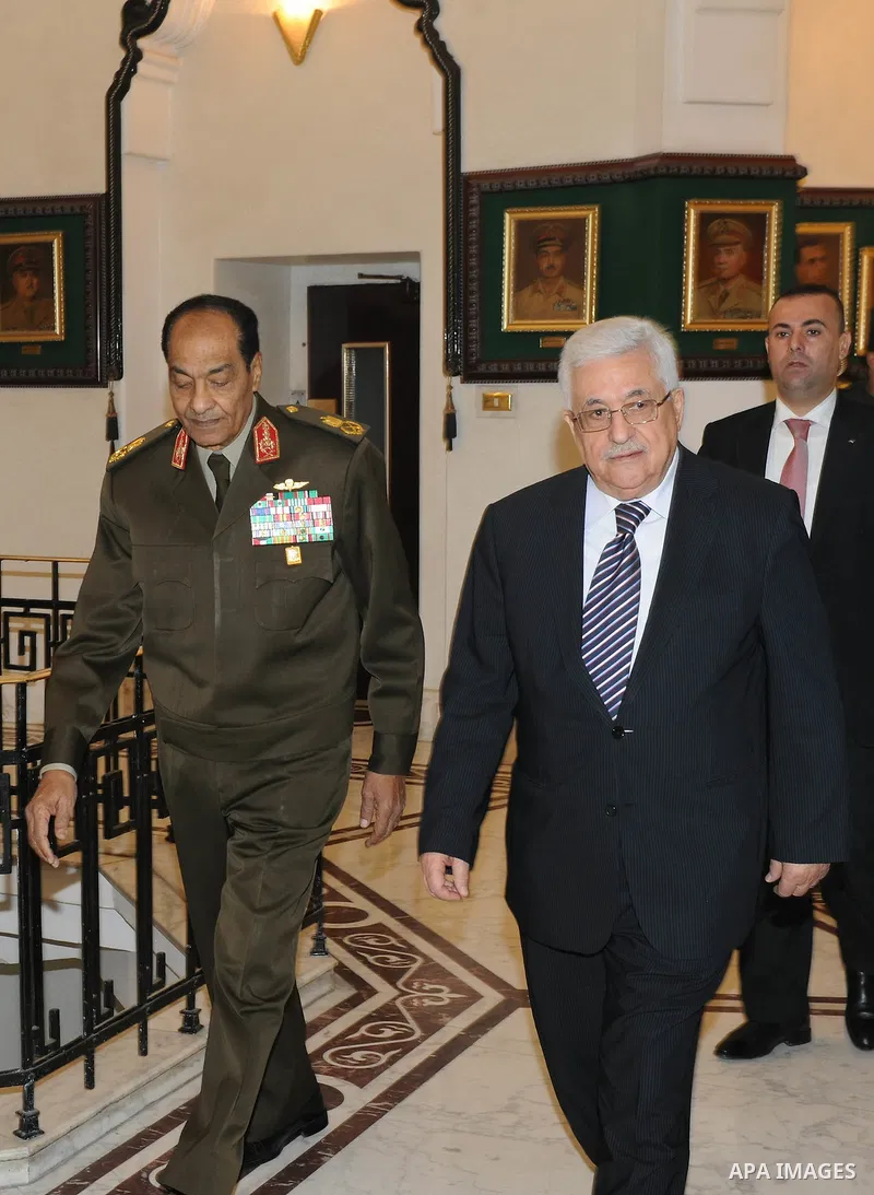 Field Marshal Mohamed Hussein Tantawi, the head of Egypt's ruling Supreme Council of the Armed Forces (SCAF), meets Palestinian President Mahmoud Abbas (L) at the Defence Ministry in Cairo December. 22, 2011. Photo by Th...