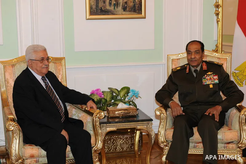 Field Marshal Mohamed Hussein Tantawi, the head of Egypt's ruling Supreme Council of the Armed Forces (SCAF), meets Palestinian President Mahmoud Abbas (L) at the Defence Ministry in Cairo December. 22, 2011. Photo by Th...