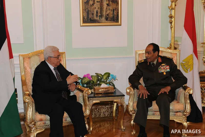 Field Marshal Mohamed Hussein Tantawi, the head of Egypt's ruling Supreme Council of the Armed Forces (SCAF), meets Palestinian President Mahmoud Abbas (L) at the Defence Ministry in Cairo December. 22, 2011. Photo by Th...