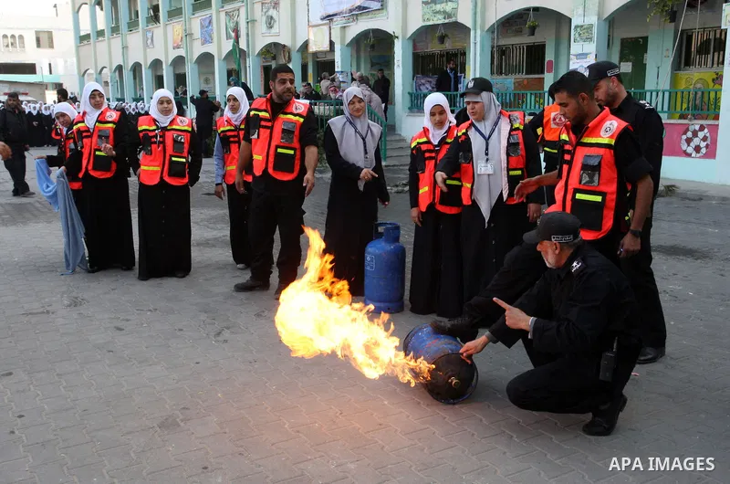 Palestinian schoolgirls take part in a civil defence exercises at a school in Rafah, in the southern of Gaza Strip on December 22, 2011. Photo by Abed Rahim Khatib