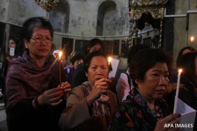 Christian pilgrims pray in the Church of the Nativity in the biblical West Bank city of Bethlehem on December 22, 2011, as Christian pilgrims started gathering in the traditional birthplace of Jesus Christ to attend the...