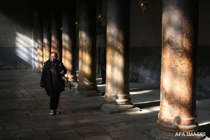 Christian pilgrims visit the Church of the Nativity in the biblical West Bank city of Bethlehem on 22 December 2011 as Christian pilgrims start gathering in the church belived to be the birthplace of Jesus Christ to cele...