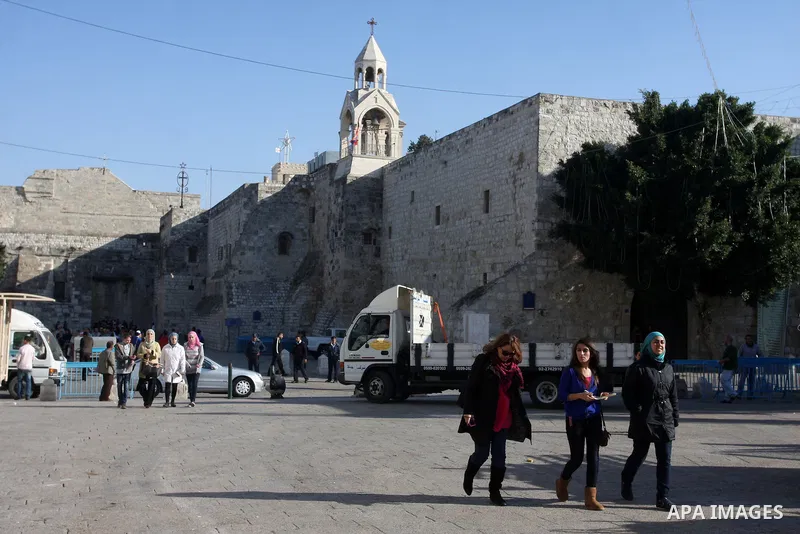 Christian pilgrims visit the Church of the Nativity in the biblical West Bank city of Bethlehem on 23 December 2011 as Christian pilgrims start gathering in the church belived to be the birthplace of Jesus Christ to cele...