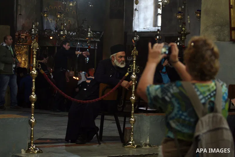 Christian pilgrims visit the Church of the Nativity in the biblical West Bank city of Bethlehem on 23 December 2011 as Christian pilgrims start gathering in the church belived to be the birthplace of Jesus Christ to cele...