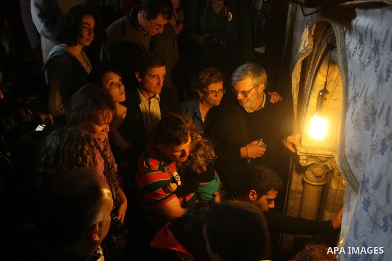Christian pilgrims visit the Church of the Nativity in the biblical West Bank city of Bethlehem on 23 December 2011 as Christian pilgrims start gathering in the church belived to be the birthplace of Jesus Christ to cele...
