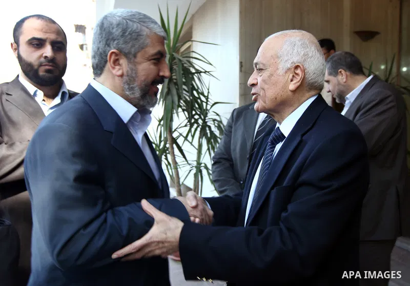 Arab League Secretary General Nabil al-Arabi (R) greeting Hamas leader Khaled Meshaal (L) in Cairo, Egypt, 23 December 2011. According to media sources, Hamas on 22 December joined a committee aimed at reforming the umbr...