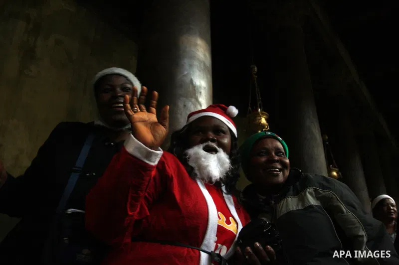 Christian pilgrims visit the Church of the Nativity in the biblical West Bank city of Bethlehem on Christmas Eve on 24 December 2011. Photo by Issam Rimawi