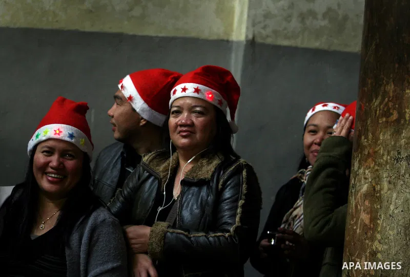 Christian pilgrims visit the Church of the Nativity in the biblical West Bank city of Bethlehem on Christmas Eve on 24 December 2011. Photo by Issam Rimawi