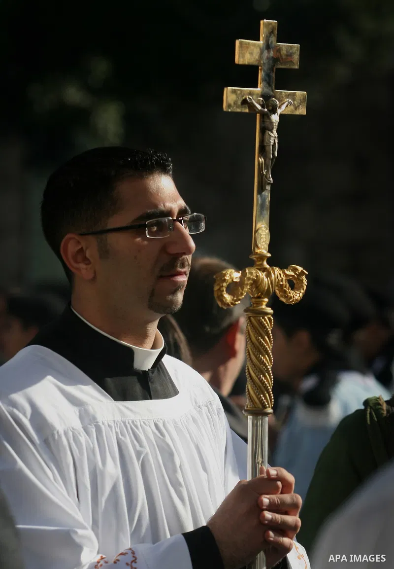 Christian pilgrims visit the Church of the Nativity in the biblical West Bank city of Bethlehem on Christmas Eve on 24 December 2011, as thousands of Christian pilgrims descended on the holy city to celebrate in Jesus' t...