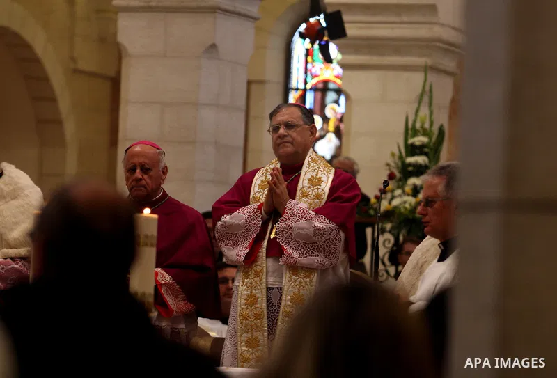 The Latin Patriarch of Jerusalem Fouad Twal waves upon his arrival to the Church of the Nativity to attend Christmas celebrations in West Bank town of Bethlehem December 24, 2011. Photo by Issam Rimawi