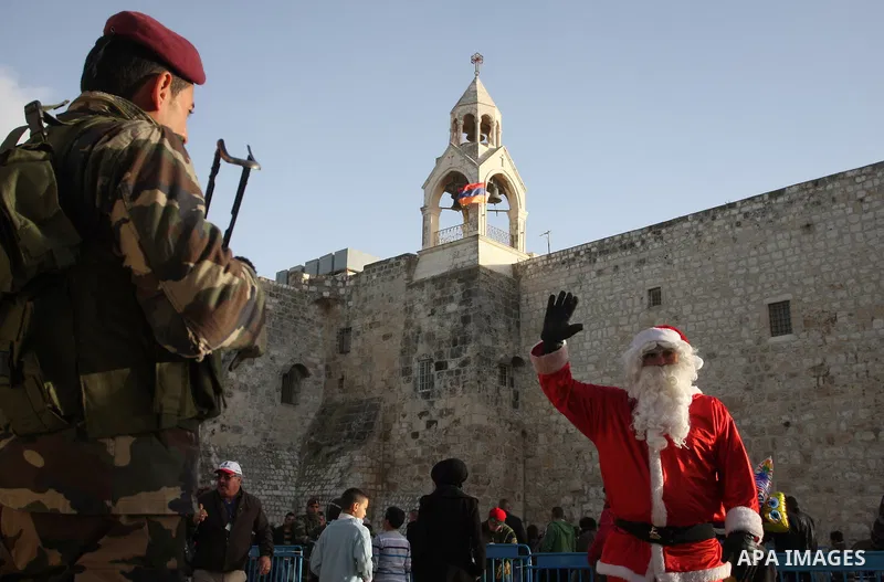 Christian pilgrims visit the Church of the Nativity in the biblical West Bank city of Bethlehem on Christmas Eve on 24 December 2011, as thousands of Christian pilgrims descended on the holy city to celebrate in Jesus' t...