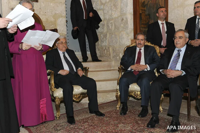 Palestinian President, Mahmoud Abbas (Abu Mazen) participante Mass held by the private community in the Church of St. Alangalkanh Grace in the west bank city of Bethlehem, on Dec. 24, 2011. Photo by Thaer Ganaim