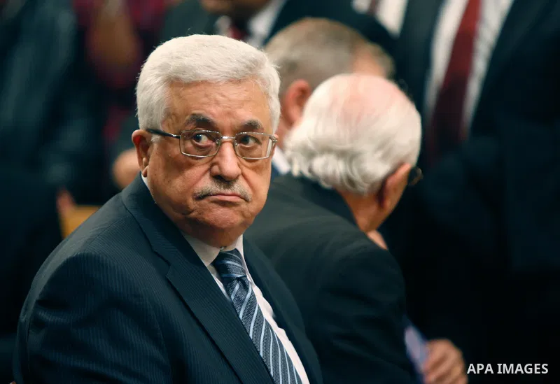 Palestinian President Mahmoud Abbas attends the Christmas midnight Mass at the Church of the Nativity, traditionally believed to be the birthplace of Jesus Christ, in the West Bank town of Bethlehem early Sunday, Dec. 25...