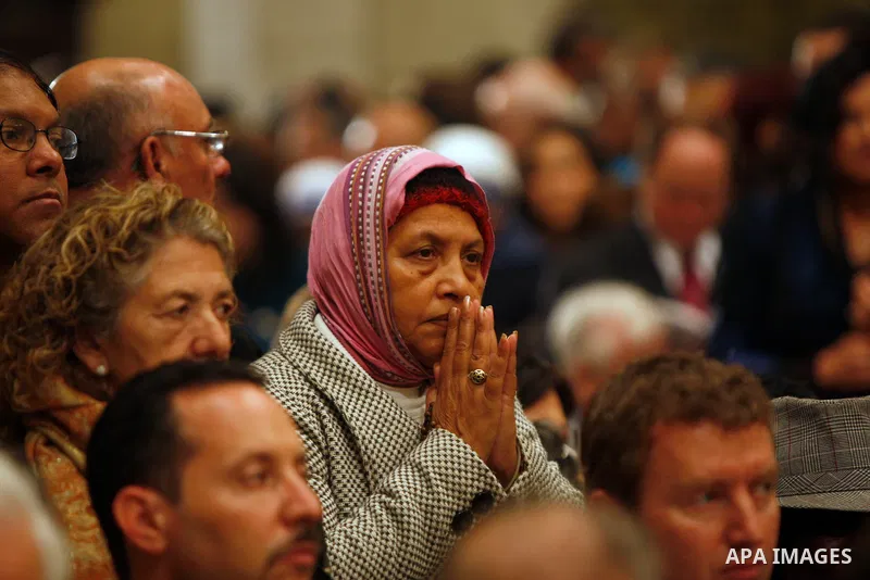 Christian pilgrim prays during the Christmas midnight Mass at the Church of the Nativity, traditionally believed to be the birthplace of Jesus Christ, in the West Bank town of Bethlehem early Sunday, Dec. 25, 2011. (APAi...