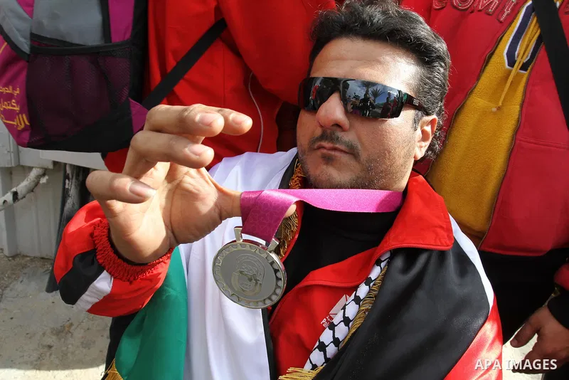 Palestinian members of the Paralympic Games for the disabled participate in training at Al-Gezira Club in Gaza city on Dec. 25, 2011. Palestinian Paralympic Games won Arab and international medals and have achieved excel...