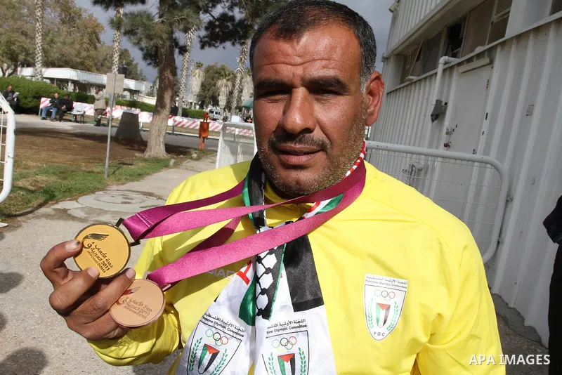 Palestinian members of the Paralympic Games for the disabled participate in training at Al-Gezira Club in Gaza city on Dec. 25, 2011. Palestinian Paralympic Games won Arab and international medals and have achieved excel...