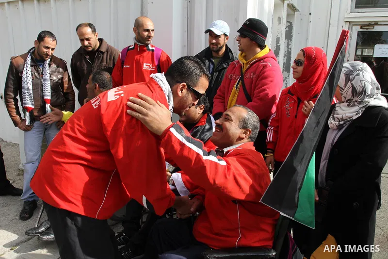 Palestinian members of the Paralympic Games for the disabled participate in training at Al-Gezira Club in Gaza city on Dec. 25, 2011. Palestinian Paralympic Games won Arab and international medals and have achieved excel...
