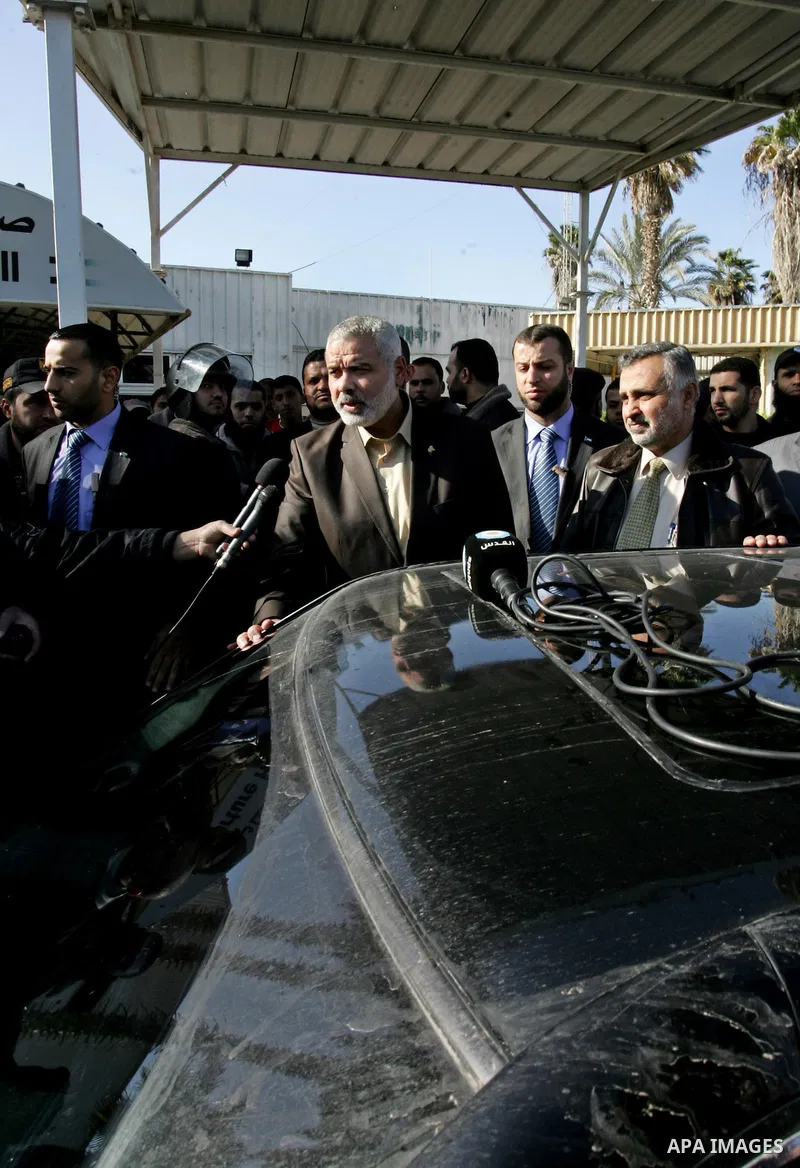 Palestinian Prime Minister in Gaza Strip, Ismail Haniya, arrived to the Rafah border crossing in the southern Gaza Strip on Dec 25, 2011. Haniya will go in foreign tour to participate in an international conference for J...
