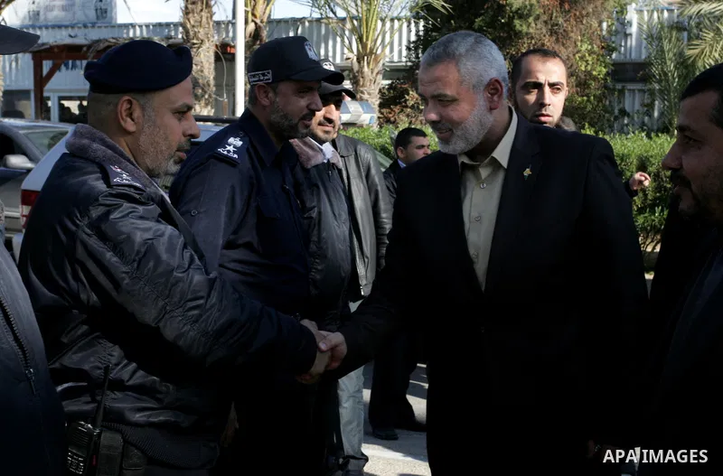Palestinian Prime Minister in Gaza Strip, Ismail Haniya, arrived to the Rafah border crossing in the southern Gaza Strip on Dec 25, 2011. Haniya will go in foreign tour to participate in an international conference for J...