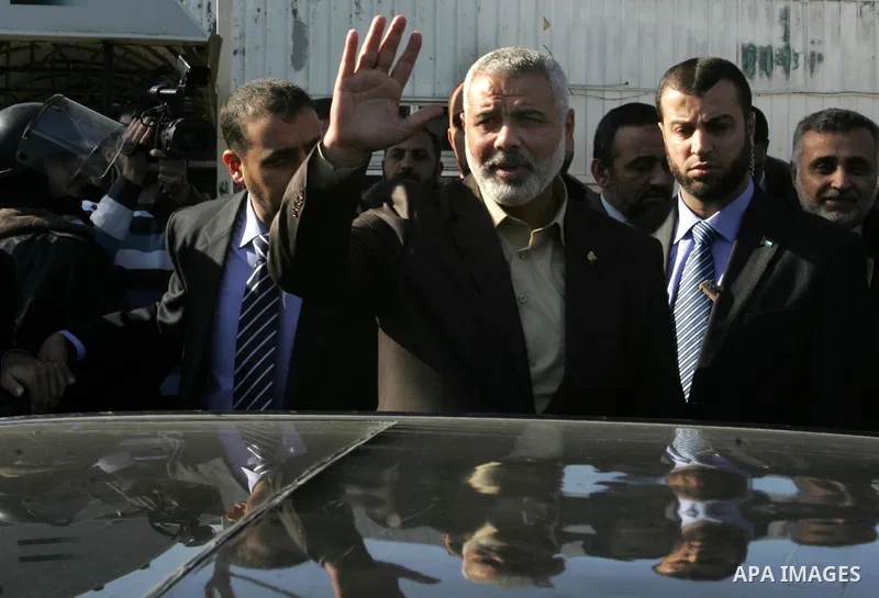 Palestinian Prime Minister in Gaza Strip, Ismail Haniya, arrived to the Rafah border crossing in the southern Gaza Strip on Dec 25, 2011. Haniya will go in foreign tour to participate in an international conference for J...