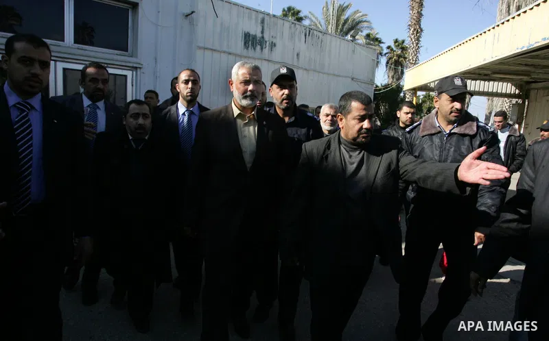 Palestinian Prime Minister in Gaza Strip, Ismail Haniya, arrived to the Rafah border crossing in the southern Gaza Strip on Dec 25, 2011. Haniya will go in foreign tour to participate in an international conference for J...