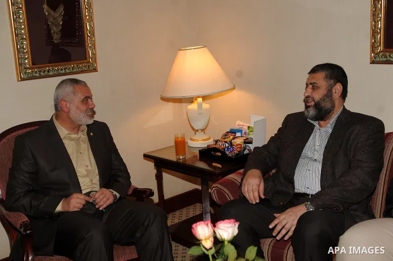 A handout picture released by the press office of Hamas shows Palestinian Hamas premier of Gaza Ismail Haniya, meeting with Khayrat al-Shater, a senior member of Egypt's Muslim Brotherhood, in Cairo on December 25, 2011....