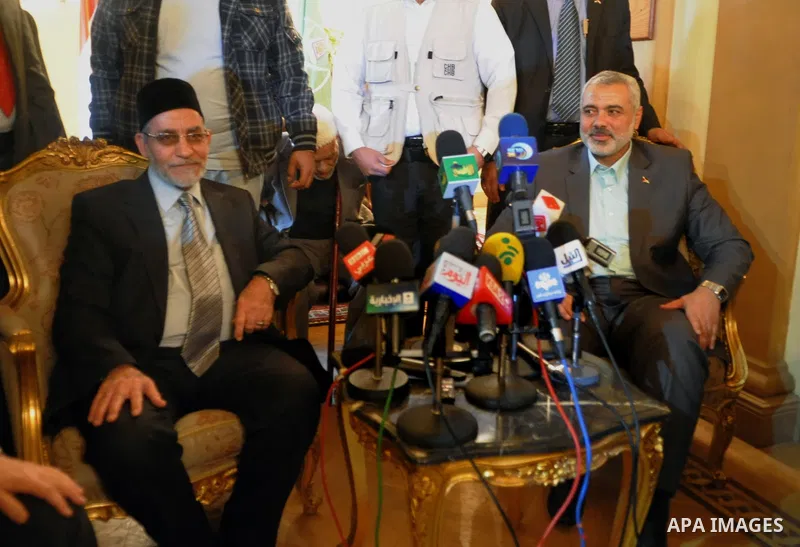 Egypt's Muslim Brotherhood leader Mohammed Badie (L) and Palestinian premie minister of Gaza Strip (R) during their press conference in Cairo, Egypt, 26 December 2011. According to media sources, Haniyeh started on 25 De...