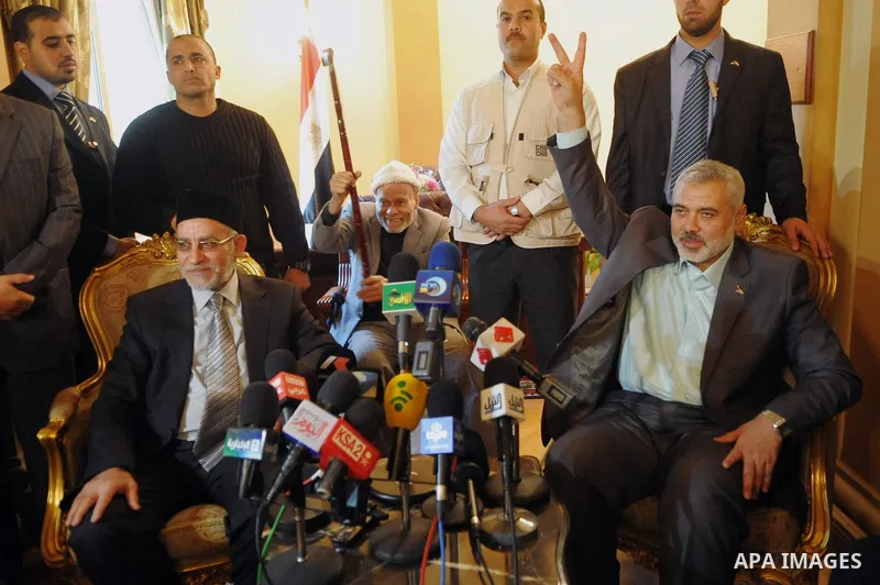 Egypt's Muslim Brotherhood leader Mohammed Badie (L) and Palestinian premie minister of Gaza Strip (R) during their press conference in Cairo, Egypt, 26 December 2011. According to media sources, Haniyeh started on 25 De...
