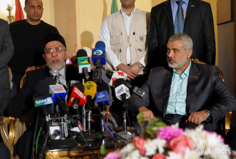 Egypt's Muslim Brotherhood leader Mohammed Badie (L) and Palestinian premie minister of Gaza Strip (R) during their press conference in Cairo, Egypt, 26 December 2011. According to media sources, Haniyeh started on 25 De...
