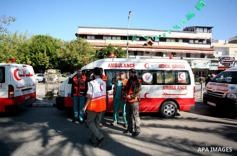 Members of the Palestinian civil defence during thier tour in the third anniversary of the Israeli war on the Gaza Strip in Gaza city on Dec. 27,2011. Photo by Mahmud Nassar