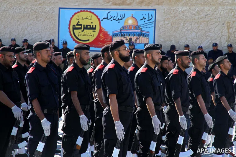 Palestinian members of Hamas security forces stand in formation during a graduation ceremony for new recruits in Gaza City on December 27, 2011. Photo by Ashraf Amra.