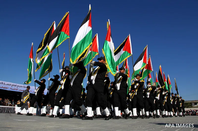 Palestinian members of Hamas security forces stand in formation during a graduation ceremony for new recruits in Gaza City on December 27, 2011. Photo by Ashraf Amra.
