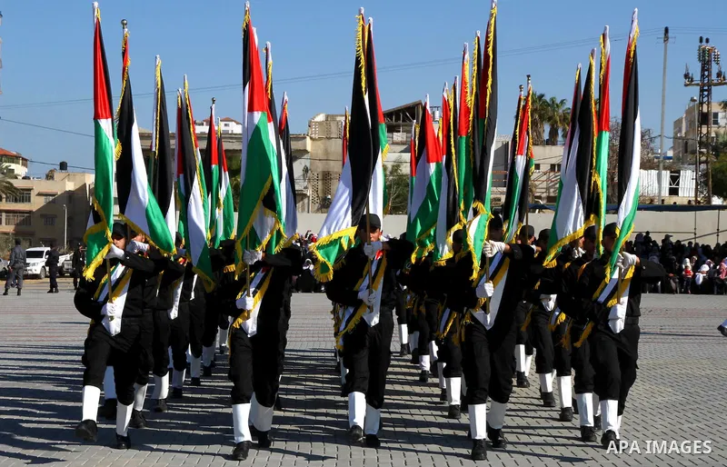 Palestinian members of Hamas security forces stand in formation during a graduation ceremony for new recruits in Gaza City on December 27, 2011. Photo by Ashraf Amra.