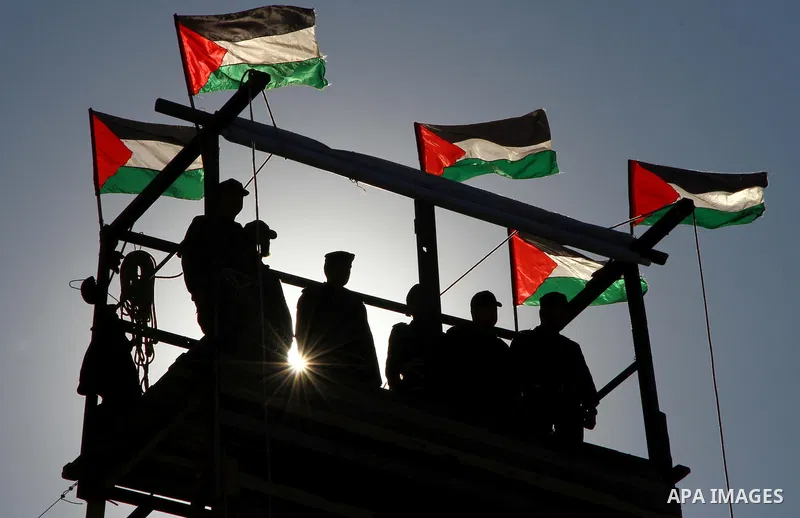 Palestinian Hamas security men march during a graduation ceremony of a military training course of the ministry of interior in Gaza City on 27 December 2011. Photo by Ashraf Amra.