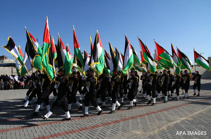 Palestinian Hamas security men march during a graduation ceremony of a military training course of the ministry of interior in Gaza City on 27 December 2011. Photo by Ashraf Amra.