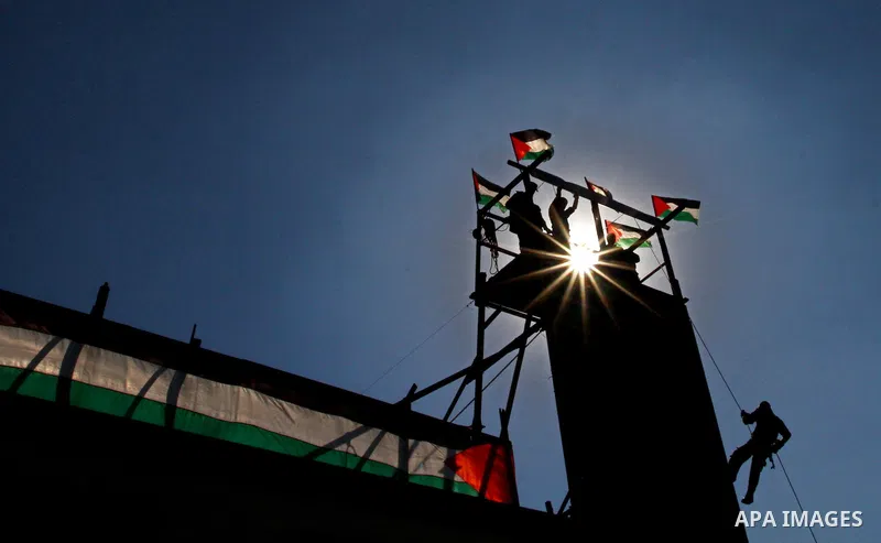 Palestinian Hamas security men march during a graduation ceremony of a military training course of the ministry of interior in Gaza City on 27 December 2011. Photo by Ashraf Amra.