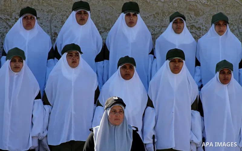 Palestinian Hamas security women march during a graduation ceremony of a military training course of the ministry of interior in Gaza City on 27 December 2011. Photo by Ashraf Amra.