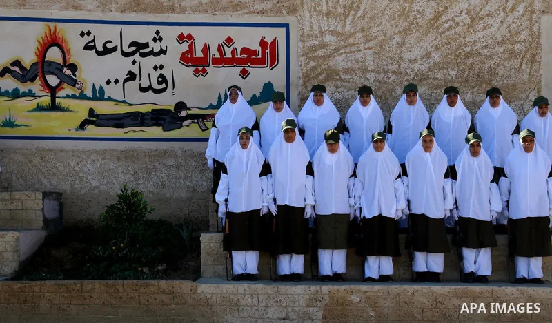 Palestinian Hamas security women march during a graduation ceremony of a military training course of the ministry of interior in Gaza City on 27 December 2011. Photo by Ashraf Amra.