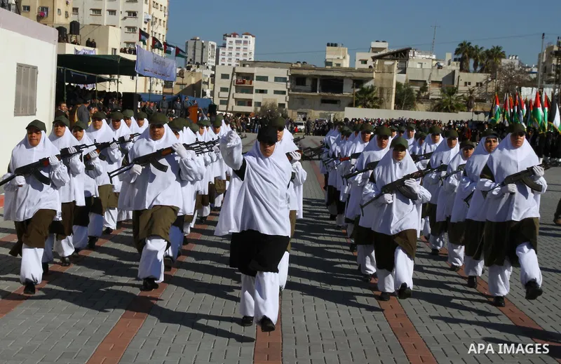 Palestinian Hamas security women march during a graduation ceremony of a military training course of the ministry of interior in Gaza City on 27 December 2011. Photo by Ashraf Amra.
