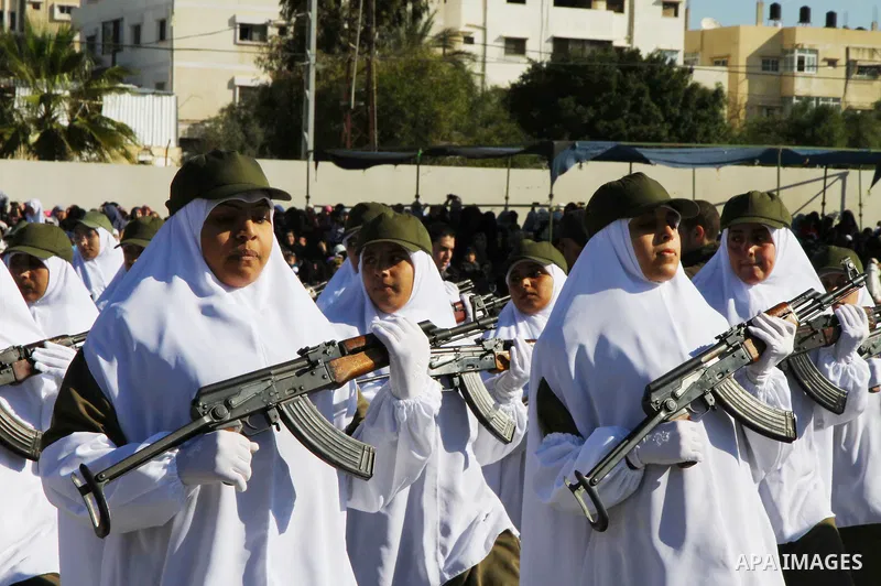 Palestinian Hamas security women march during a graduation ceremony of a military training course of the ministry of interior in Gaza City on 27 December 2011. Photo by Ashraf Amra