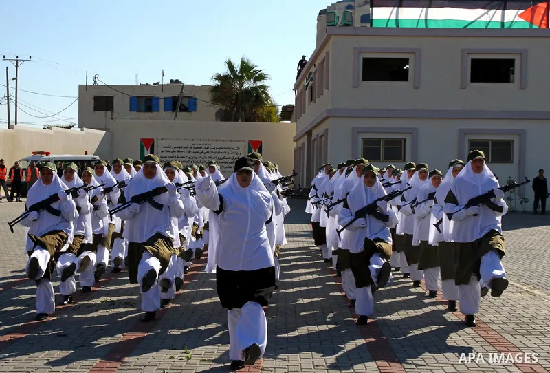 Palestinian Hamas security women march during a graduation ceremony of a military training course of the ministry of interior in Gaza City on 27 December 2011. Photo by Ashraf Amra