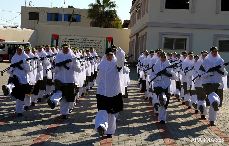 Palestinian Hamas security women march during a graduation ceremony of a military training course of the ministry of interior in Gaza City on 27 December 2011. Photo by Ashraf Amra